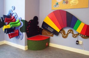 Surestart Weston tactile wall panel with boot muddle