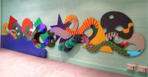 Abstract tactile wall panel with soft play wall panel