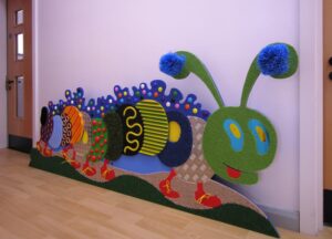 Right-facing very tactile caterpillar wall panel