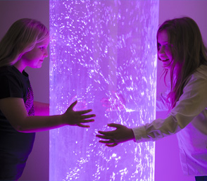 Girls holding the giant purple bubble tube