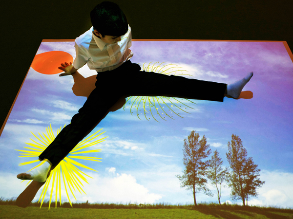 boy sitting on omi's floor projected image