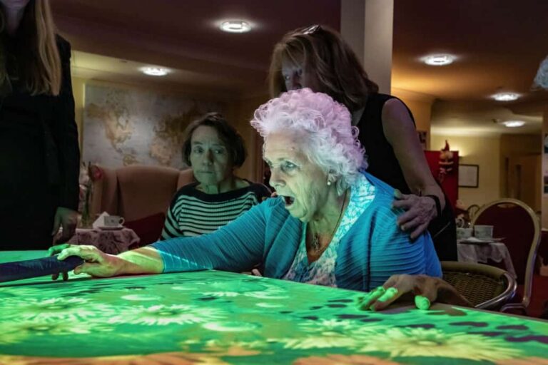 Elderly Woman Playing Projected Interactive Activity